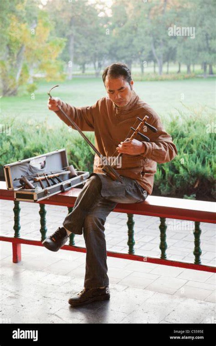 man playing erhu